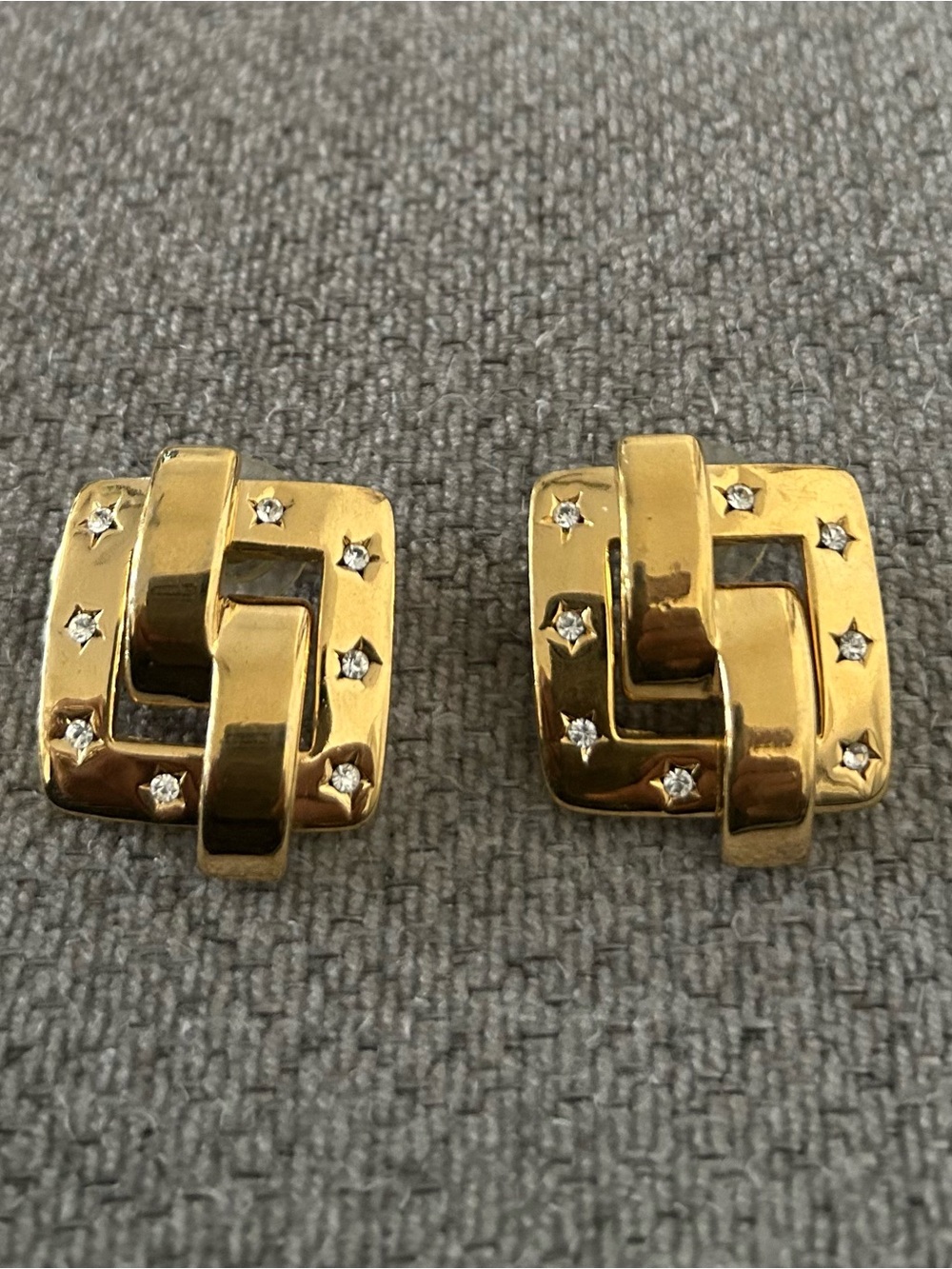 John Rivers has Gold-Tone Interlocking Knot Clip OnEarrings with Crystal Accents
